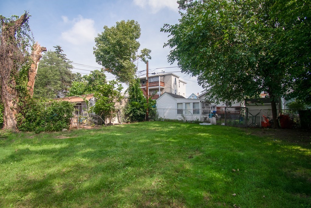 335 Oakland Street Springfield, MA 01108 - Photo 41 of 42 a view of a house with a yard and sitting area