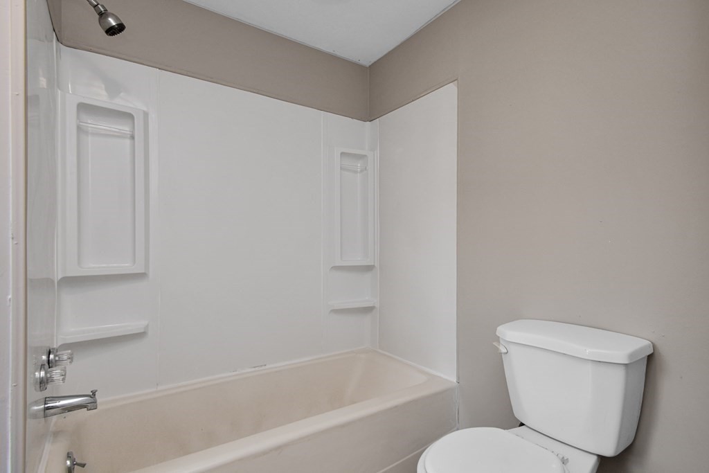 335 Oakland Street Springfield, MA 01108 - Photo 5 of 42 a white toilet sitting next to a bath tub