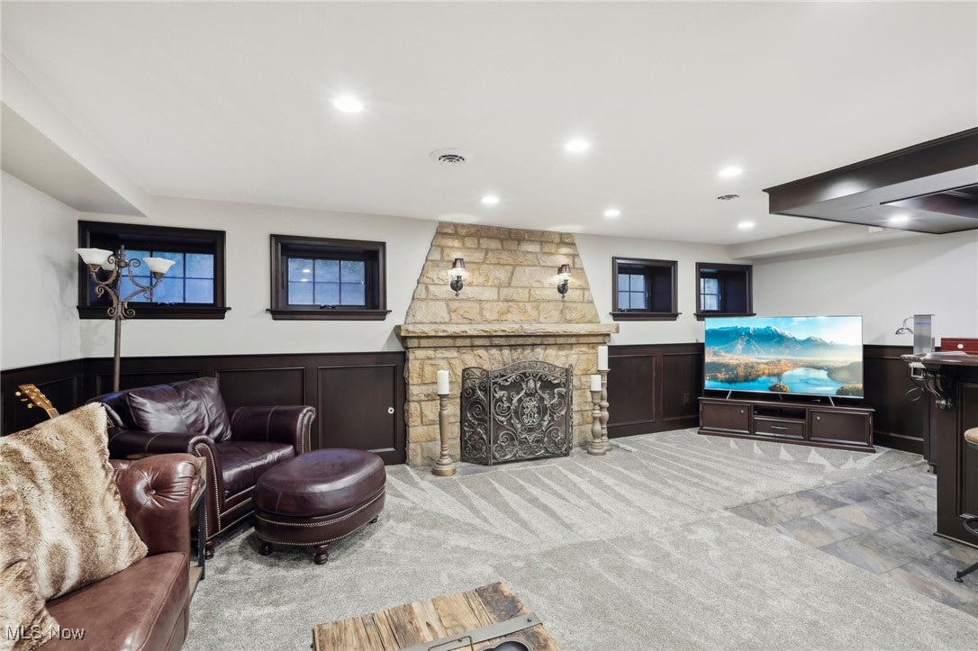 875 Mayfair Road Akron, OH 44303 - Photo 30 of 40 Living room featuring a stone fireplace and light colored carpet