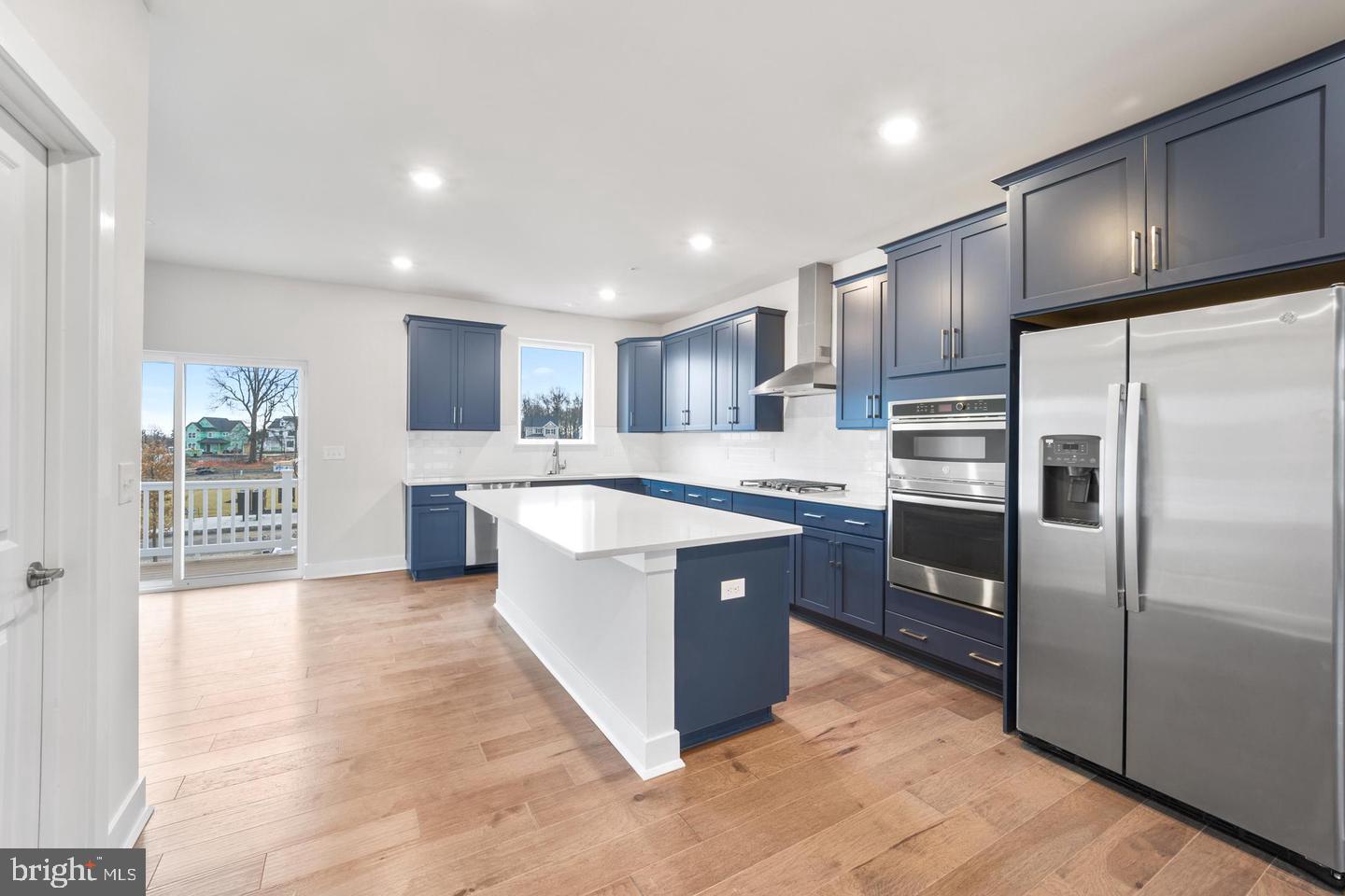 Kitchen with island, stainless steel appliances
