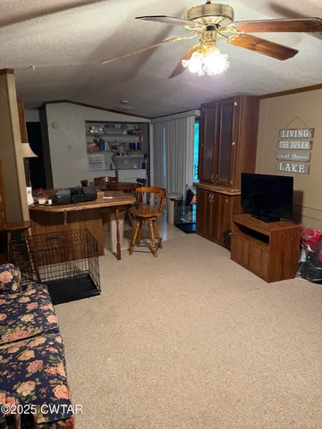 a room with furniture and a flat screen tv