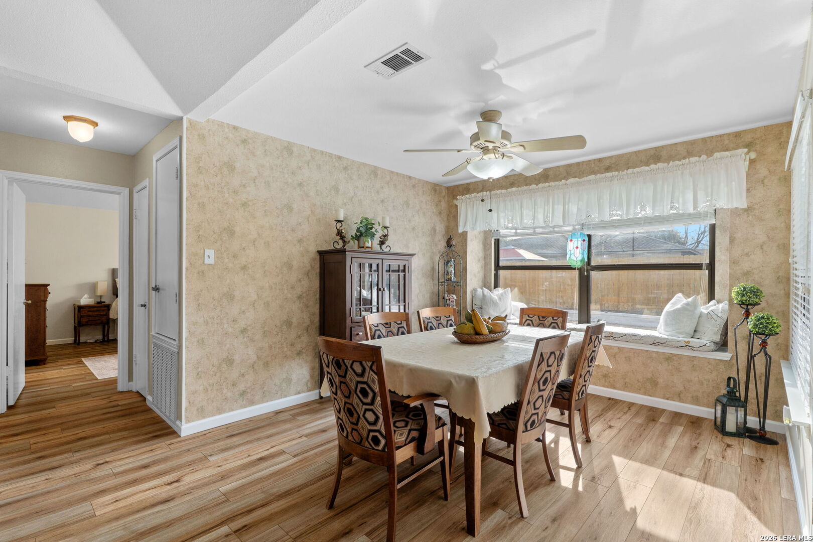 2501 Newning Schertz, TX 78154 - Photo 13 of 28 a view of a dining room with furniture window and wooden floor