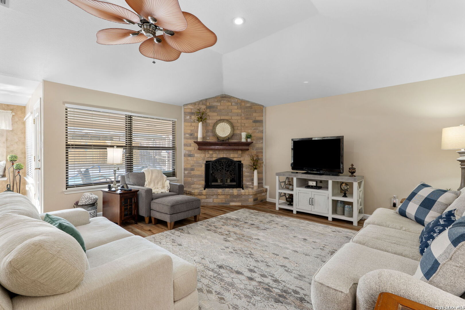 2501 Newning Schertz, TX 78154 - Photo 3 of 28 a living room with furniture a flat screen tv and a fireplace