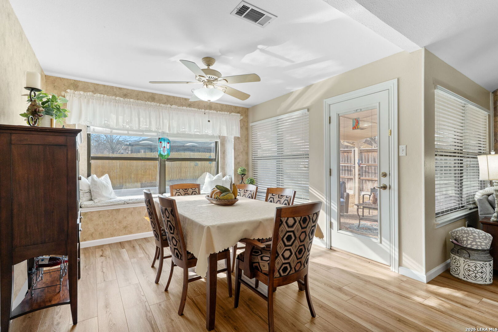 2501 Newning Schertz, TX 78154 - Photo 4 of 28 a view of a dining room with furniture window and wooden floor