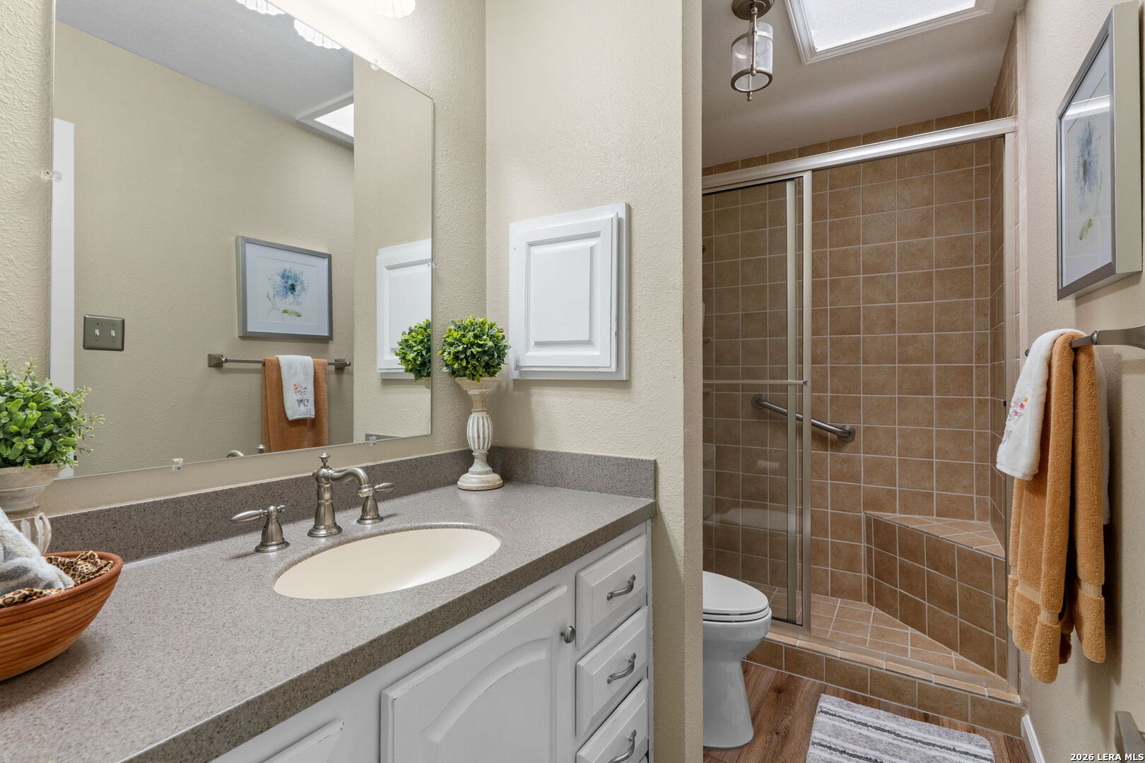 2501 Newning Schertz, TX 78154 - Photo 8 of 28 a bathroom with a granite countertop sink toilet and shower