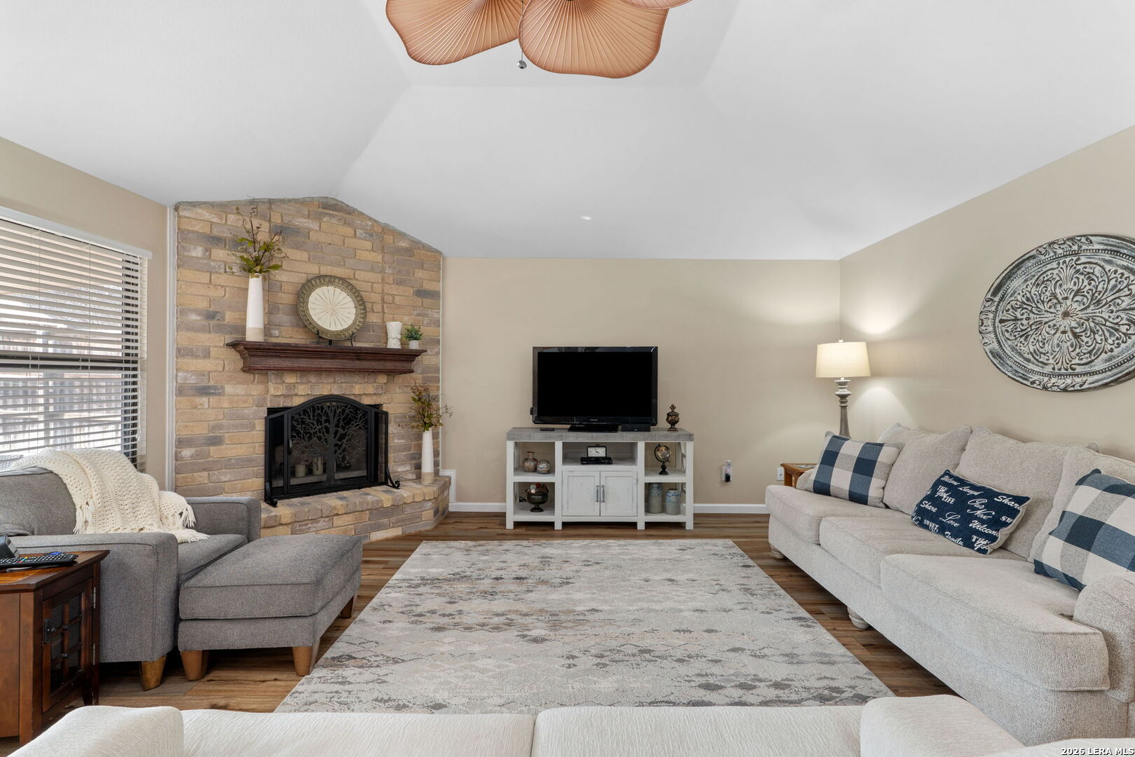 2501 Newning Schertz, TX 78154 - Photo 10 of 28 a living room with furniture a flat screen tv and a fireplace