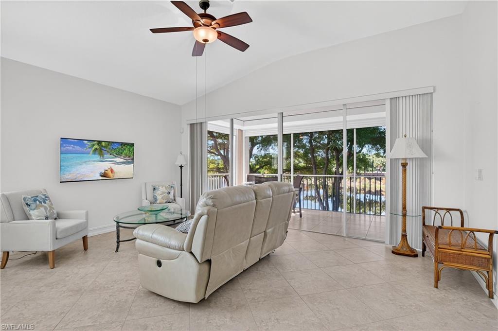 7092 Timberland Circle, Unit 201 Naples, FL 34109 - Photo 14 of 43 a living room with furniture and a window