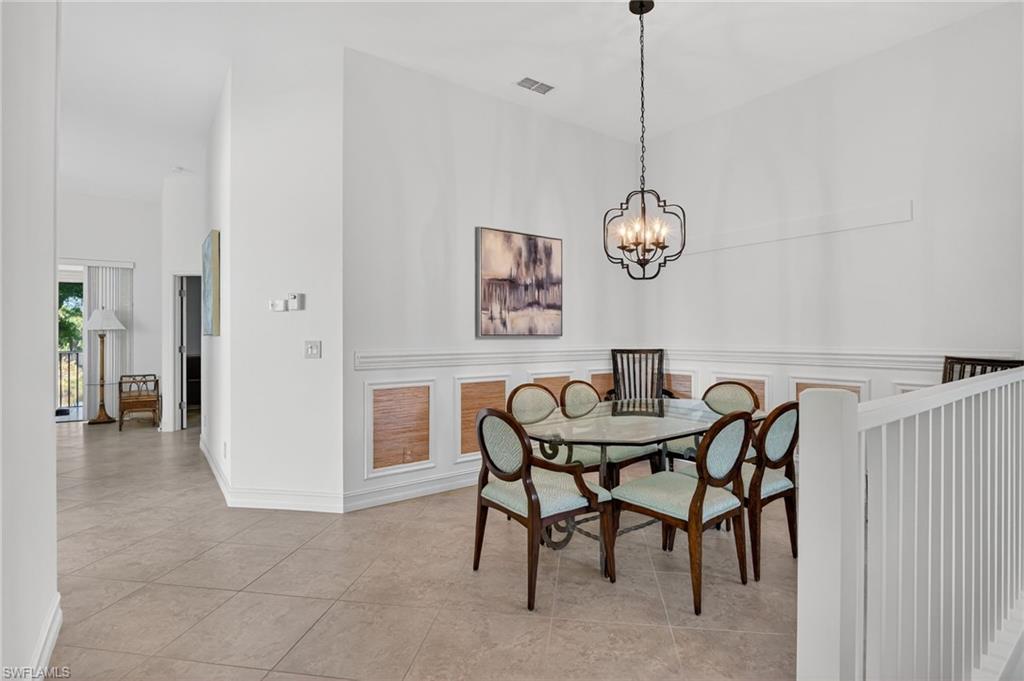 7092 Timberland Circle, Unit 201 Naples, FL 34109 - Photo 15 of 43 a dining room with furniture and window