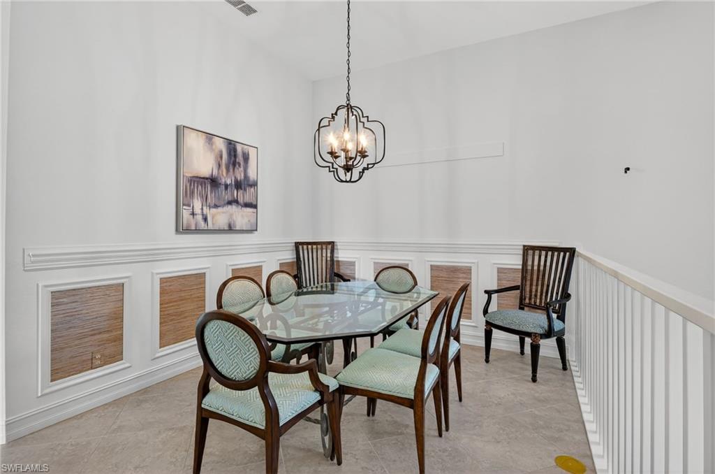 7092 Timberland Circle, Unit 201 Naples, FL 34109 - Photo 16 of 43 a dining room with furniture and window