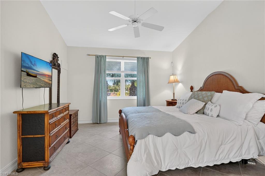 7092 Timberland Circle, Unit 201 Naples, FL 34109 - Photo 20 of 43 a bedroom with a bed and a cabinets