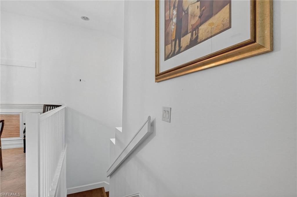 7092 Timberland Circle, Unit 201 Naples, FL 34109 - Photo 22 of 43 a view of a hallway with staircase