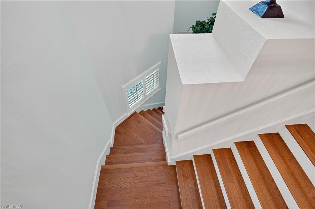 7092 Timberland Circle, Unit 201 Naples, FL 34109 - Photo 23 of 43 a view of staircase with white walls