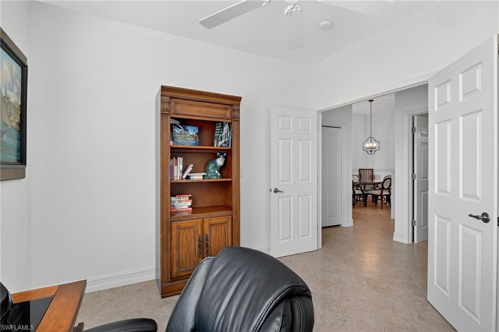 7092 Timberland Circle, Unit 201 Naples, FL 34109 - Photo 24 of 43 a view of a livingroom with a book shelf