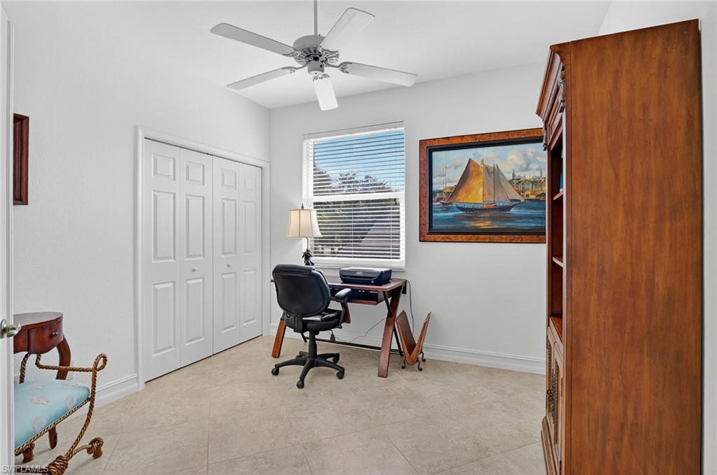 7092 Timberland Circle, Unit 201 Naples, FL 34109 - Photo 29 of 43 a workspace with wooden floor and a workspace