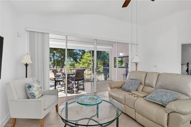 a view of a livingroom with furniture and a ceiling fan