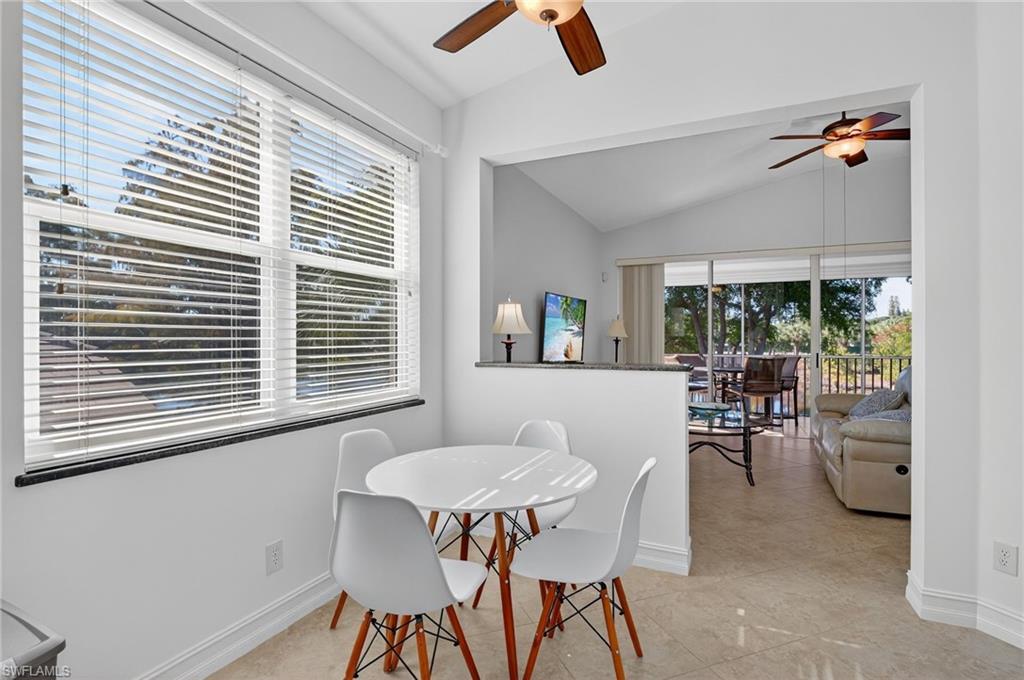 7092 Timberland Circle, Unit 201 Naples, FL 34109 - Photo 10 of 43 a view of a dining room with furniture and a window