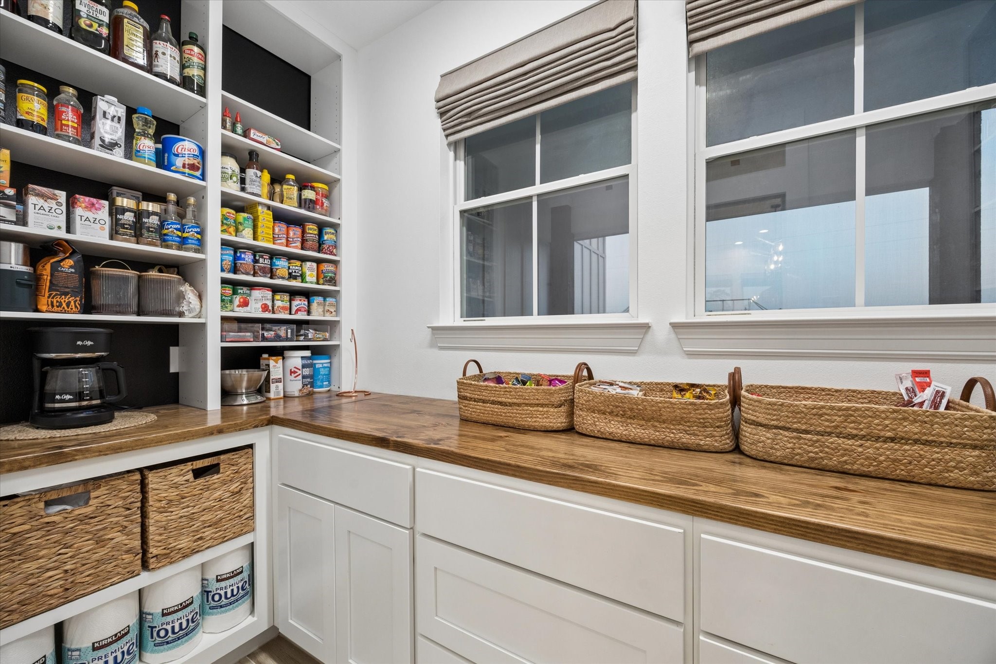 5131 Timber Ridge Drive Sealy, TX 77474 - Photo 18 of 50 Large walk-in pantry with wood countertop, and large windows for natural light.
