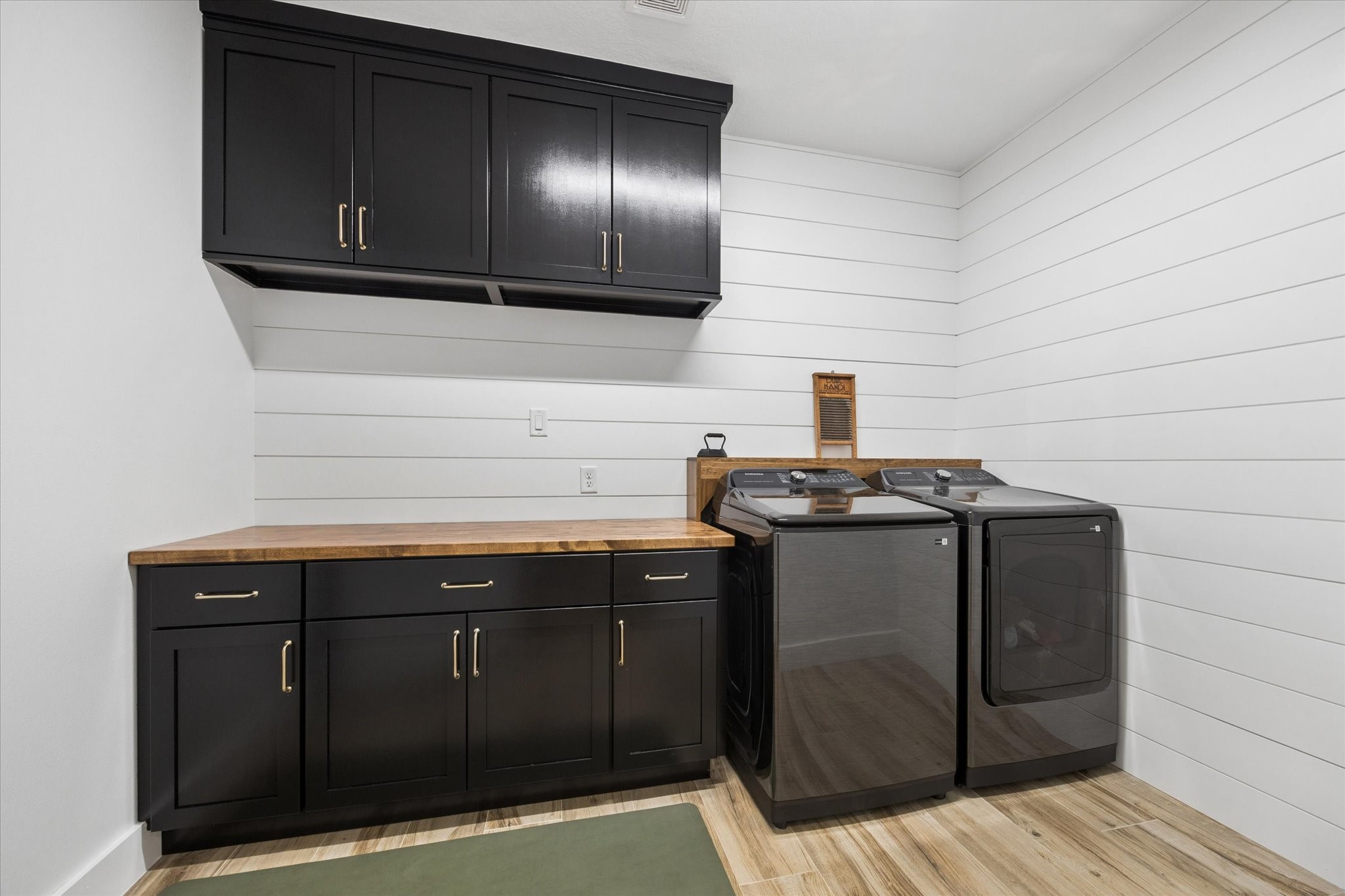 5131 Timber Ridge Drive Sealy, TX 77474 - Photo 21 of 50 Sleek laundry room with ample storage.