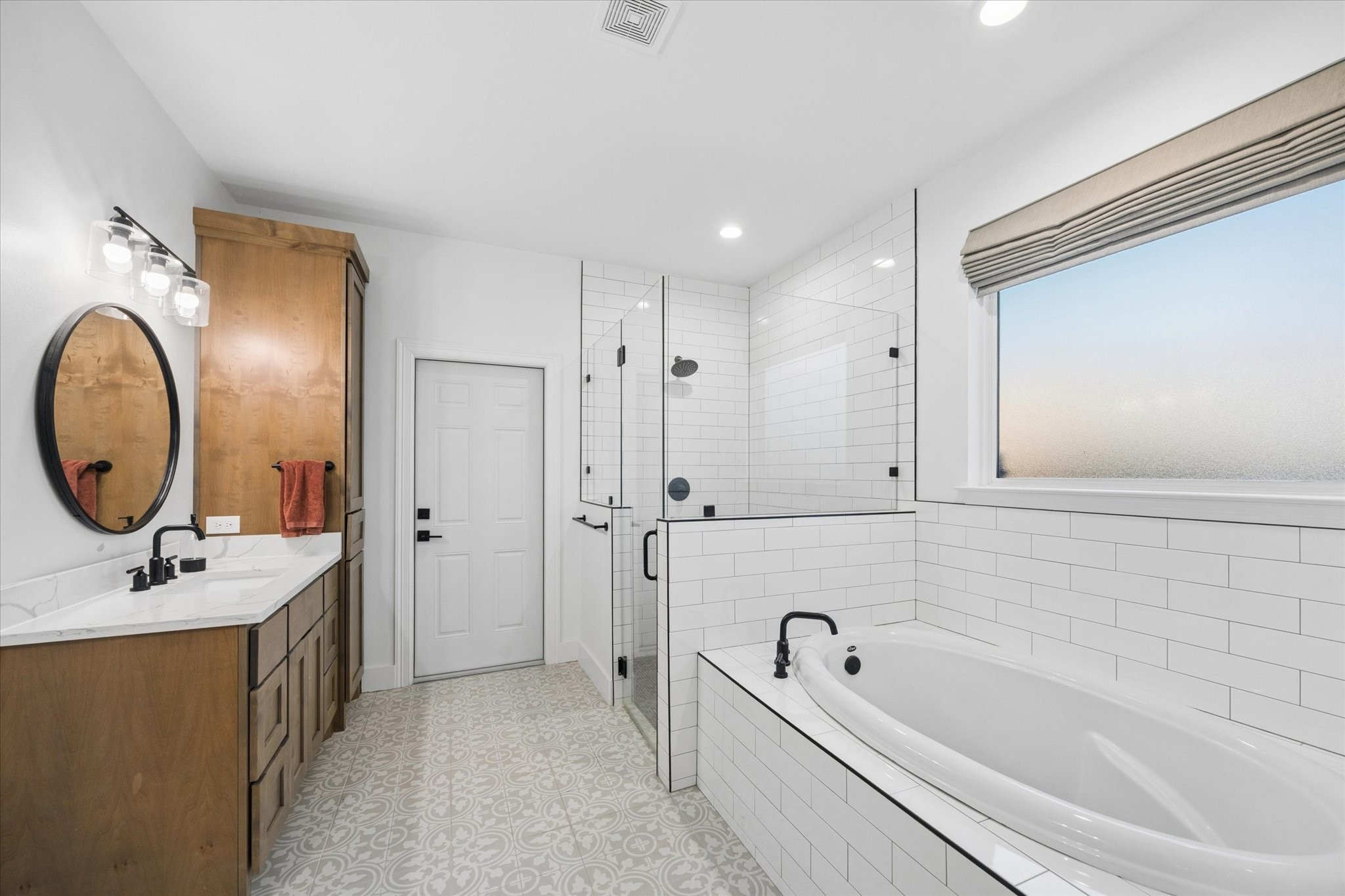 5131 Timber Ridge Drive Sealy, TX 77474 - Photo 25 of 50 Spacious white tile shower and a large bathtub.