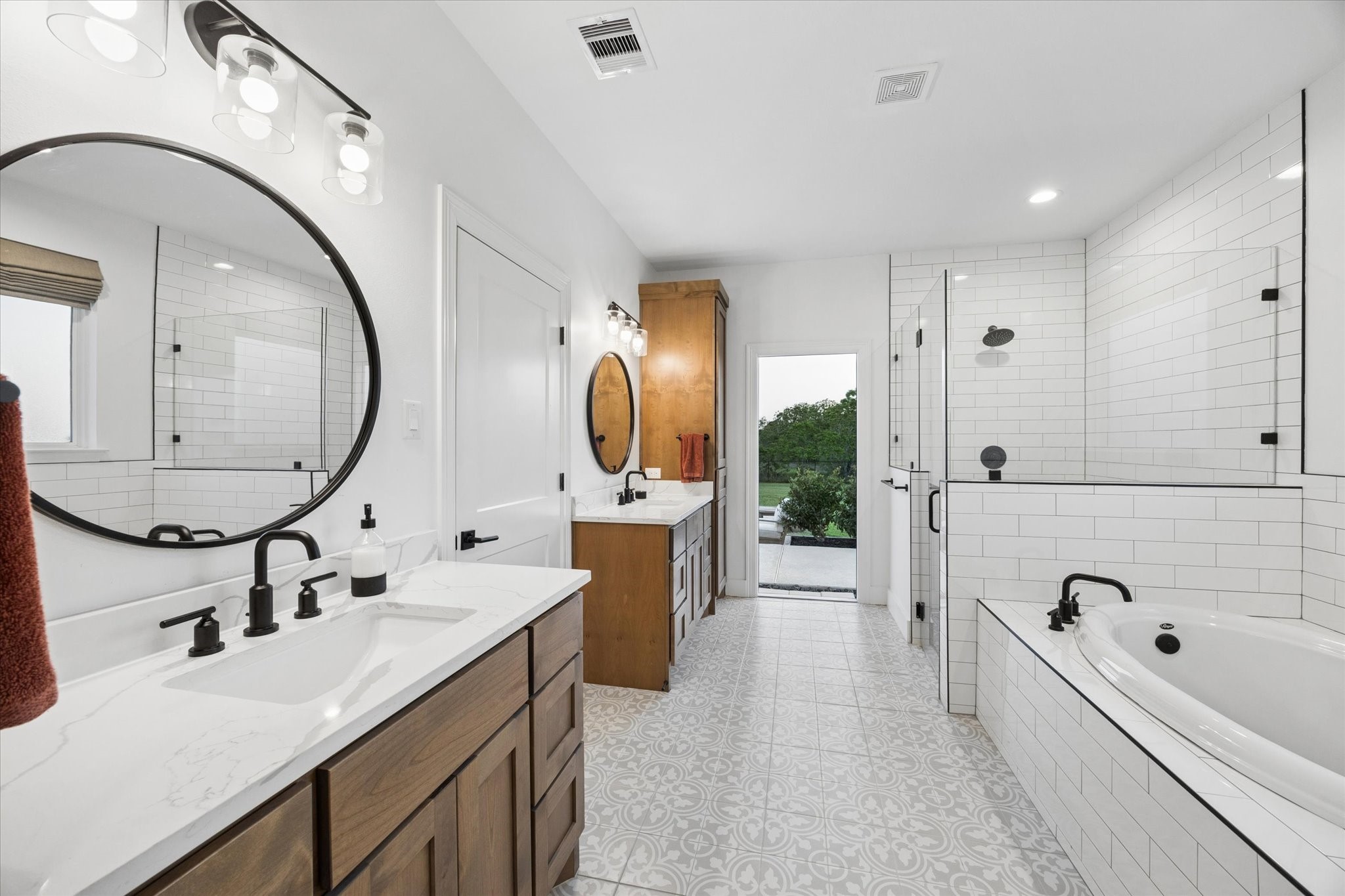 5131 Timber Ridge Drive Sealy, TX 77474 - Photo 28 of 50 Primary bathroom has an exterior door that leads out to the pool and hot tub area. Perfect for guest to use while entertaining at events.