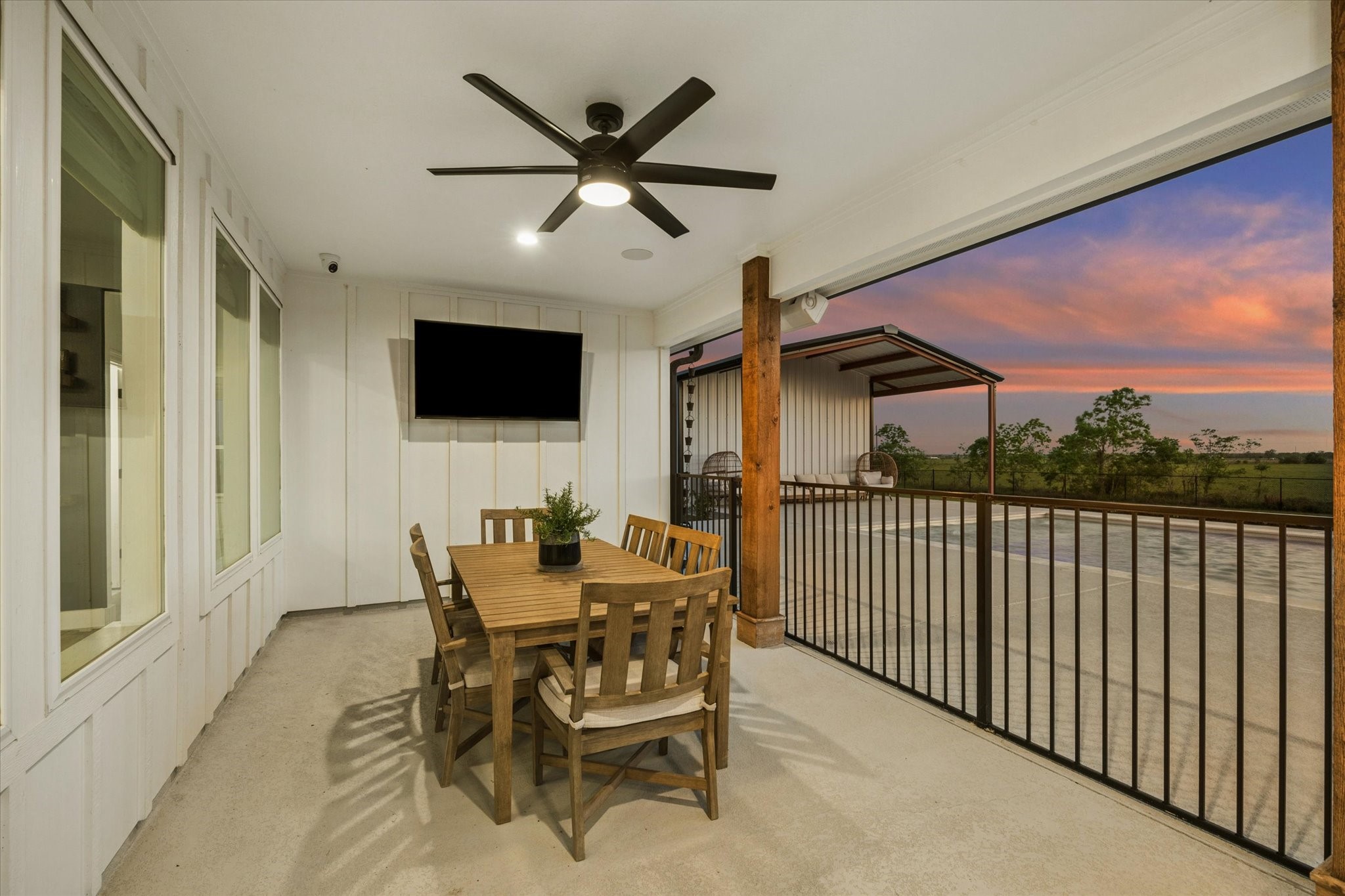 5131 Timber Ridge Drive Sealy, TX 77474 - Photo 39 of 50 Iron fenced covered patio that is perfect for entertaining.