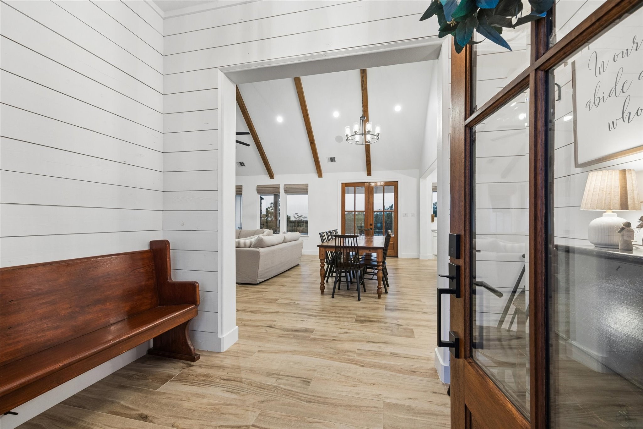 5131 Timber Ridge Drive Sealy, TX 77474 - Photo 4 of 50 Welcoming entryway leading into a spacious, open-concept living and dining area. Natural light fills the space, highlighting the modern yet rustic design elements.