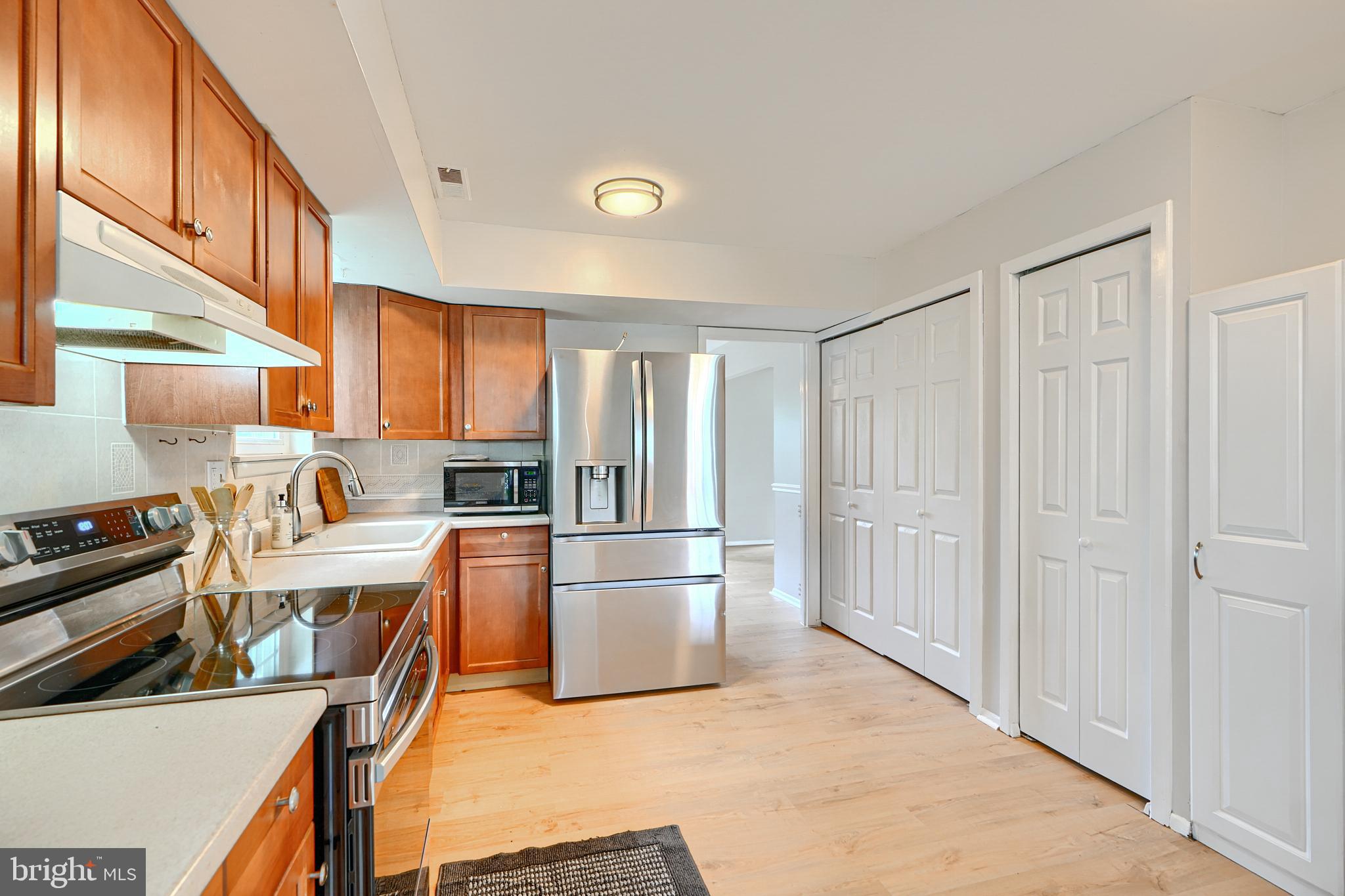 311 Laburnum Road Edgewood, MD 21040 - Photo 9 of 40 a kitchen with stainless steel appliances granite countertop a refrigerator and a stove top oven