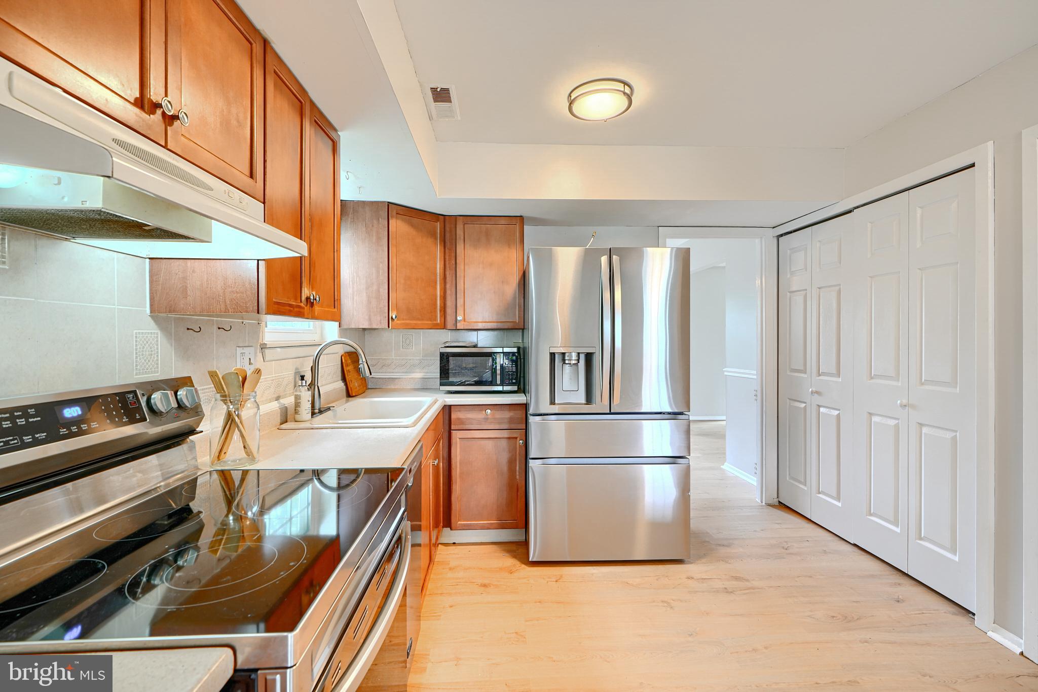 311 Laburnum Road Edgewood, MD 21040 - Photo 10 of 40 a kitchen with stainless steel appliances granite countertop a refrigerator and a stove top oven
