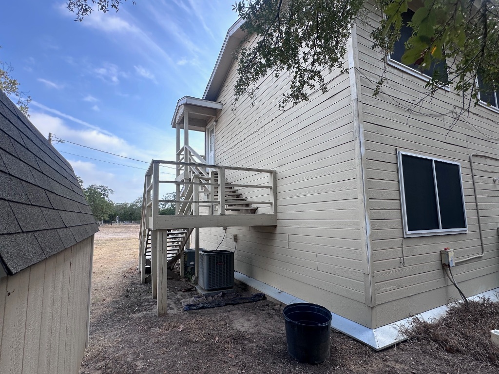 114 Thorne Road, Unit B Cedar Creek, TX 78612 - Photo 11 of 11 a view of a terrace with a table and chairs