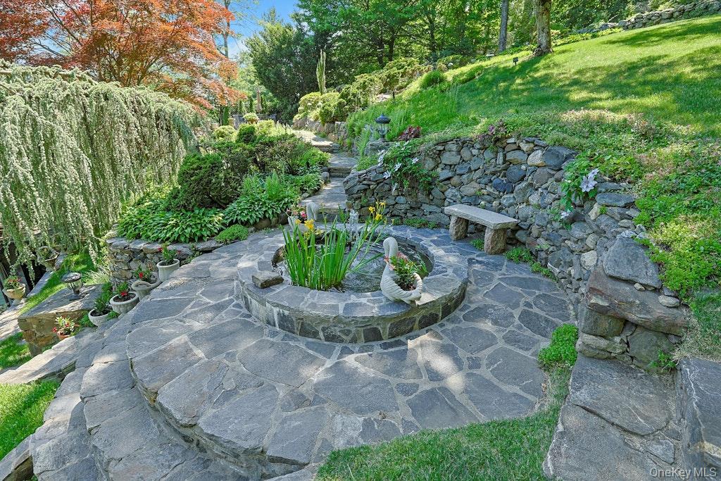 97 Underhill Road Scarsdale, NY 10583 - Photo 28 of 39 a view of a garden with potted plants
