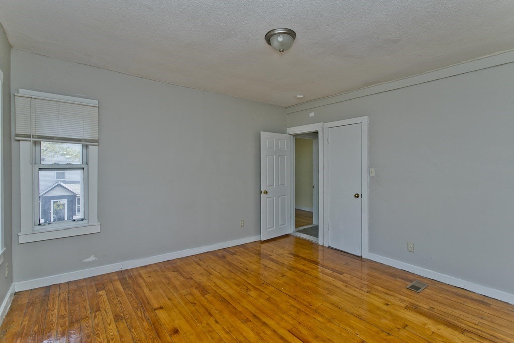 16 Nelson Avenue Springfield, MA 01109 - Photo 12 of 33 a view of empty room with wooden floor and fan