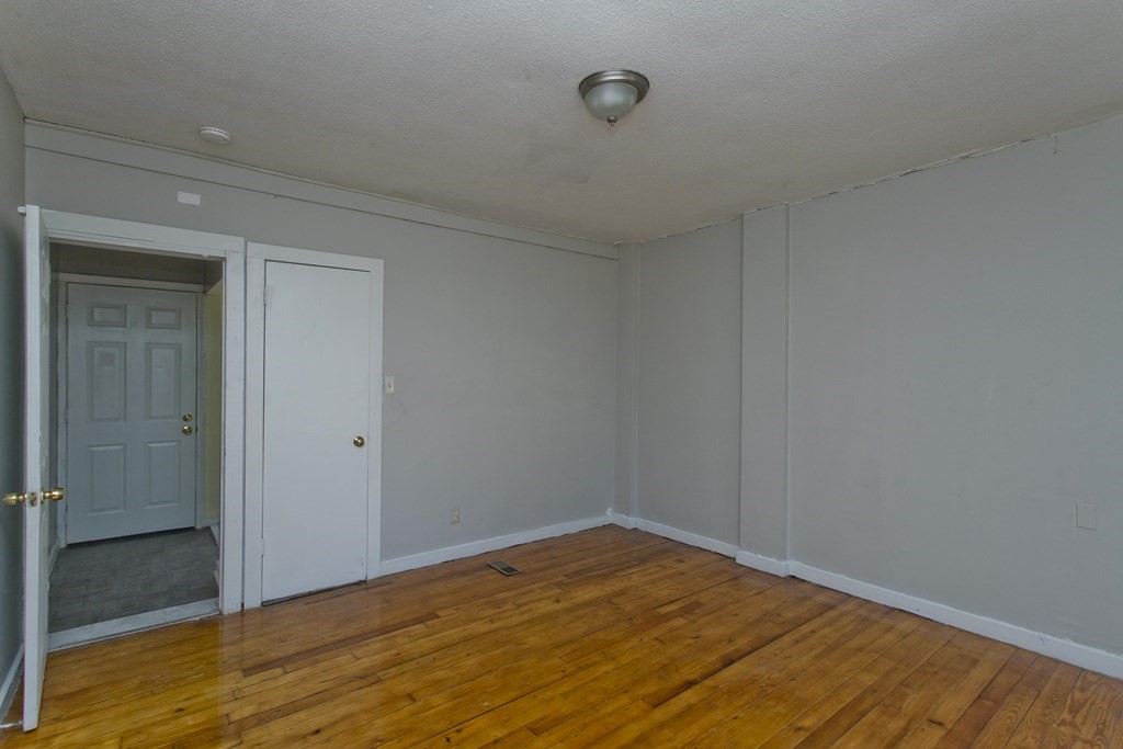 16 Nelson Avenue Springfield, MA 01109 - Photo 13 of 33 a view of empty room with wooden floor