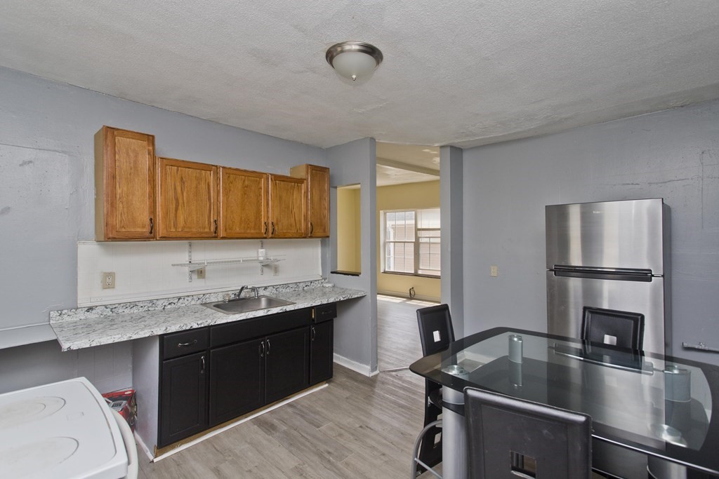 16 Nelson Avenue Springfield, MA 01109 - Photo 15 of 33 a kitchen with a sink appliances and cabinets