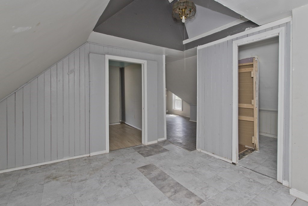 16 Nelson Avenue Springfield, MA 01109 - Photo 25 of 33 an empty room with closet and a chandelier fan