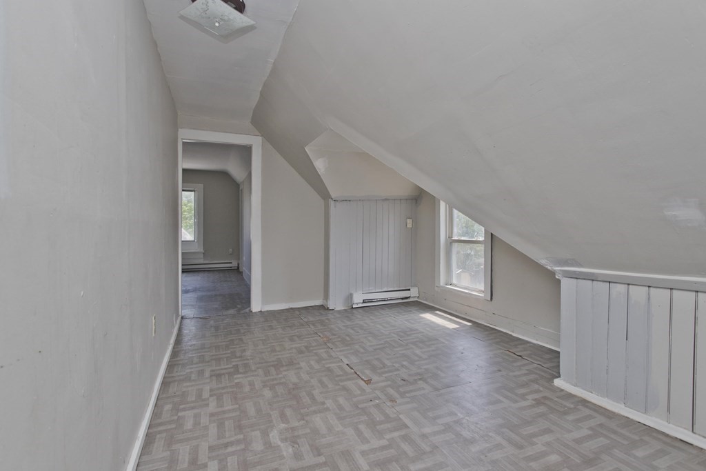 16 Nelson Avenue Springfield, MA 01109 - Photo 27 of 33 a view of an empty room with a fireplace