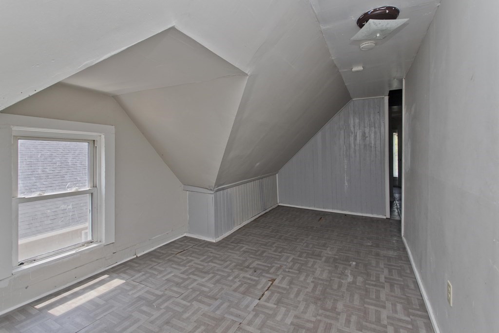 16 Nelson Avenue Springfield, MA 01109 - Photo 29 of 33 a view of a big room with stairs and a window