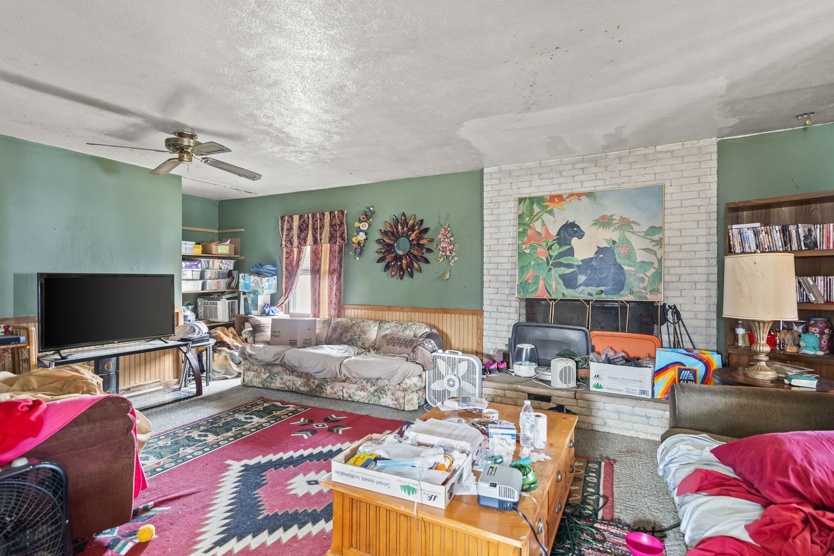 2837 South 13th Street Springfield, IL 62703 - Photo 3 of 14 a living room filled with furniture and a flat screen tv