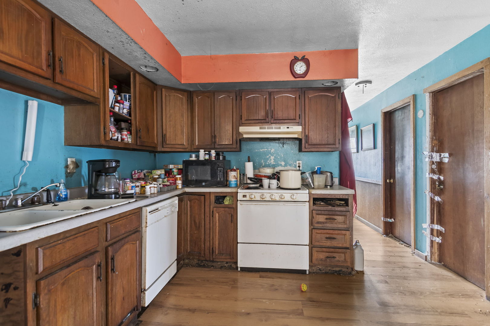 2837 South 13th Street Springfield, IL 62703 - Photo 6 of 14 a kitchen with a sink cabinets and wooden floor