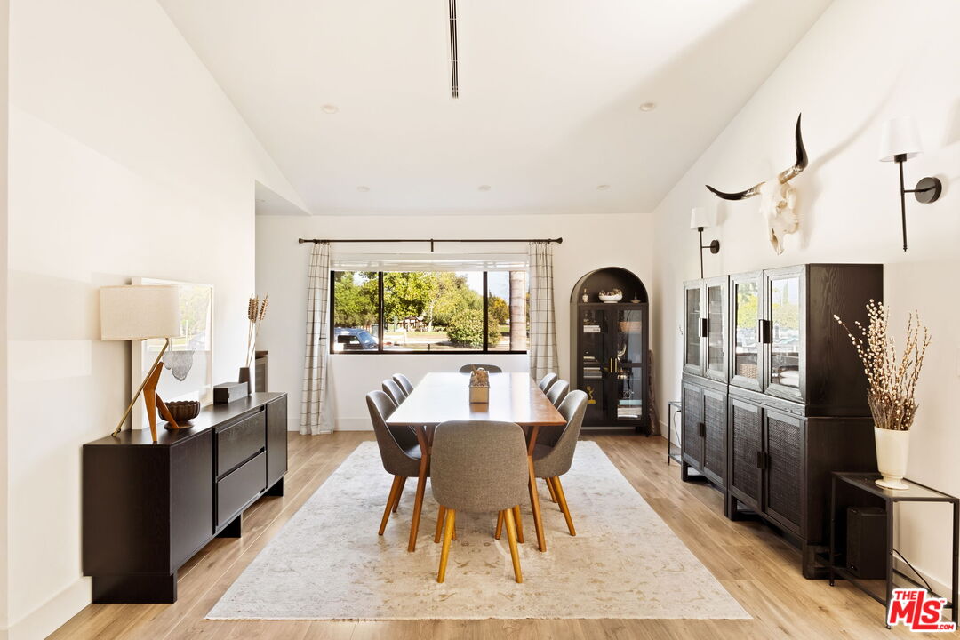6151 Atoll Avenue Valley Glen, CA 91401 - Photo 12 of 58 a dining room with furniture and window