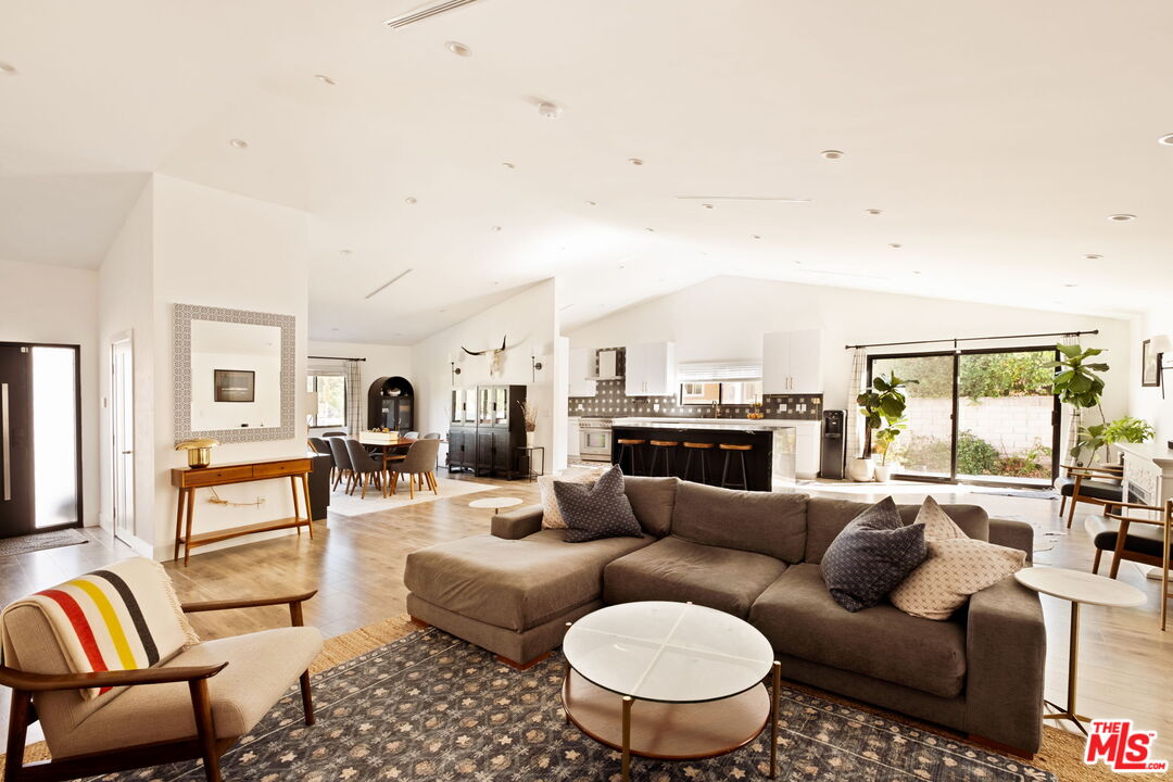 6151 Atoll Avenue Valley Glen, CA 91401 - Photo 14 of 58 a living room with furniture kitchen view and a large window