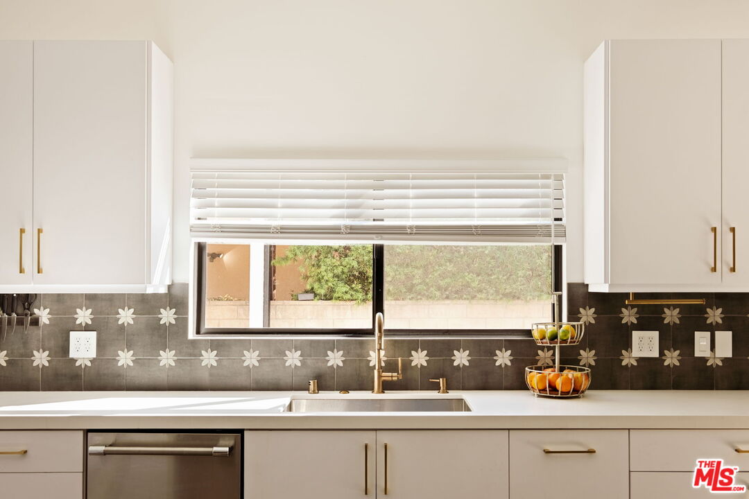 6151 Atoll Avenue Valley Glen, CA 91401 - Photo 17 of 58 a kitchen with a sink and a window
