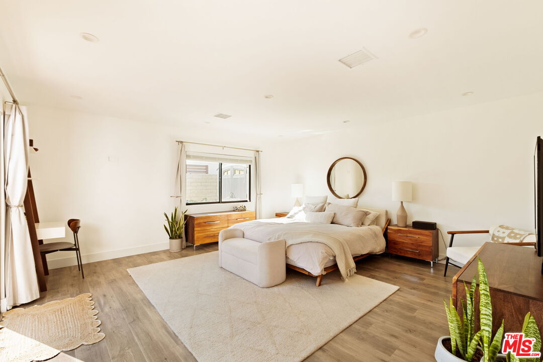 6151 Atoll Avenue Valley Glen, CA 91401 - Photo 23 of 58 a bed room with two beds and a chair