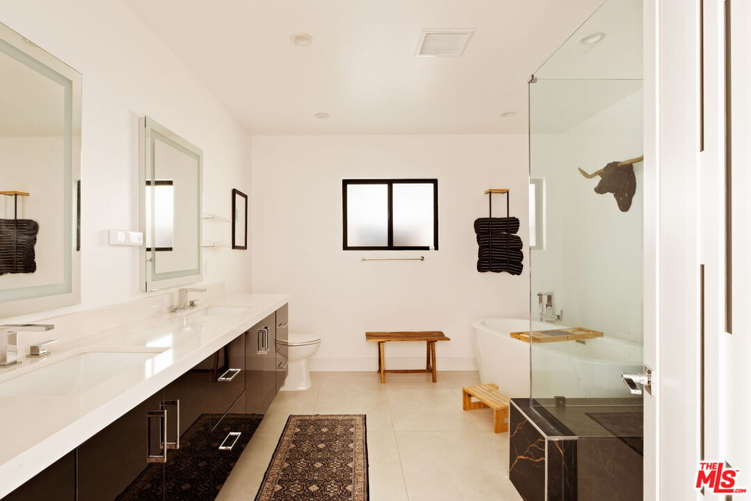 6151 Atoll Avenue Valley Glen, CA 91401 - Photo 26 of 58 a bathroom with a sink and a mirror