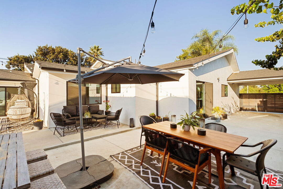 6151 Atoll Avenue Valley Glen, CA 91401 - Photo 38 of 58 a view of a dining room with furniture one side kitchen view