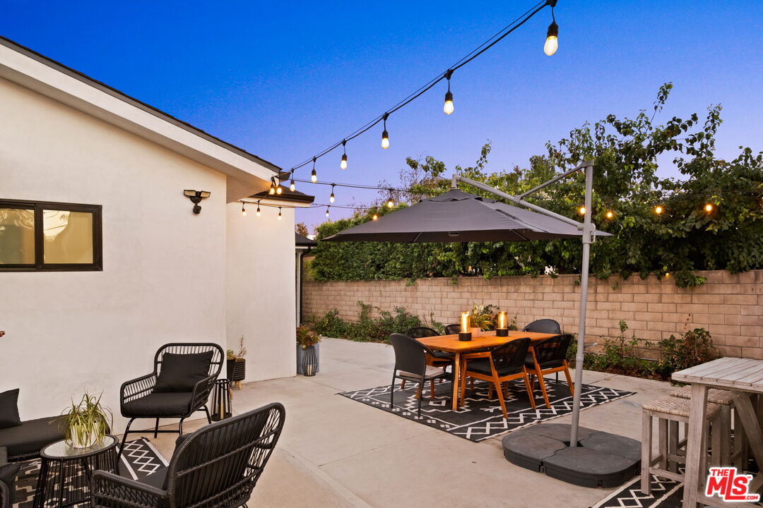 6151 Atoll Avenue Valley Glen, CA 91401 - Photo 50 of 58 a patio with patio table and chairs