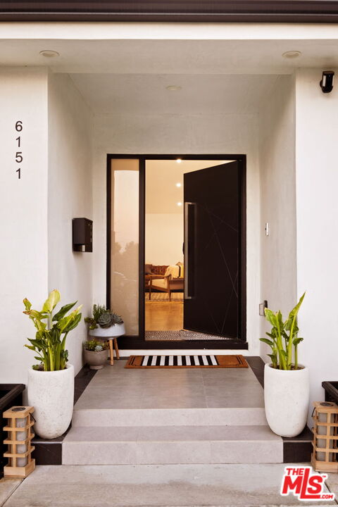 6151 Atoll Avenue Valley Glen, CA 91401 - Photo 5 of 58 a view of a living room with furniture and a potted plant