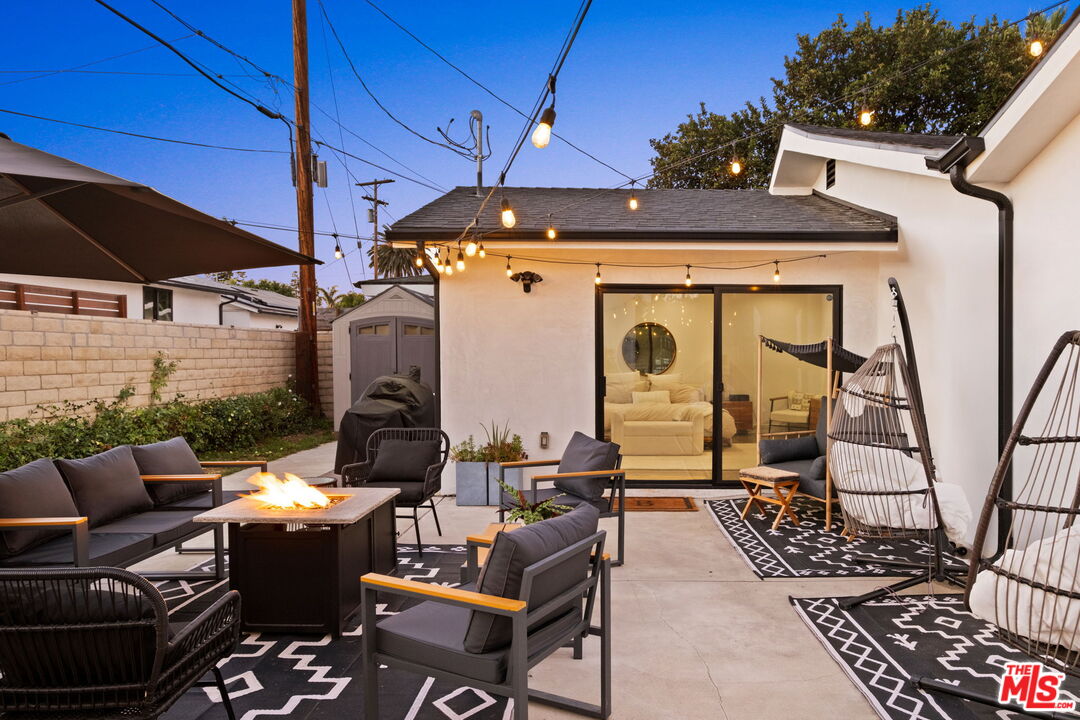 6151 Atoll Avenue Valley Glen, CA 91401 - Photo 52 of 58 a view of a patio with couches chairs and a table