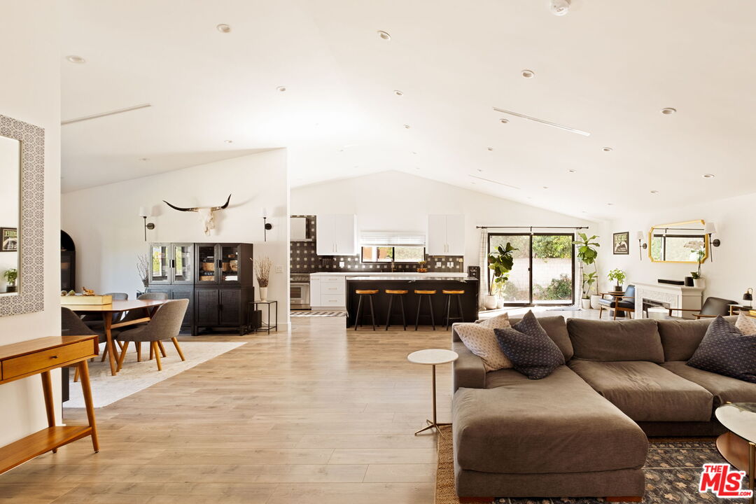 6151 Atoll Avenue Valley Glen, CA 91401 - Photo 8 of 58 a living room with furniture and a large window