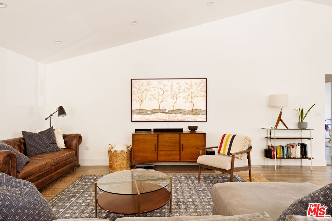 6151 Atoll Avenue Valley Glen, CA 91401 - Photo 9 of 58 a living room with furniture and a large window