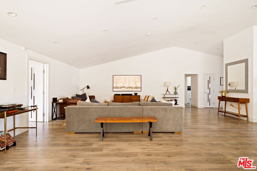 6151 Atoll Avenue Valley Glen, CA 91401 - Photo 10 of 58 a living room with furniture and a wooden floor